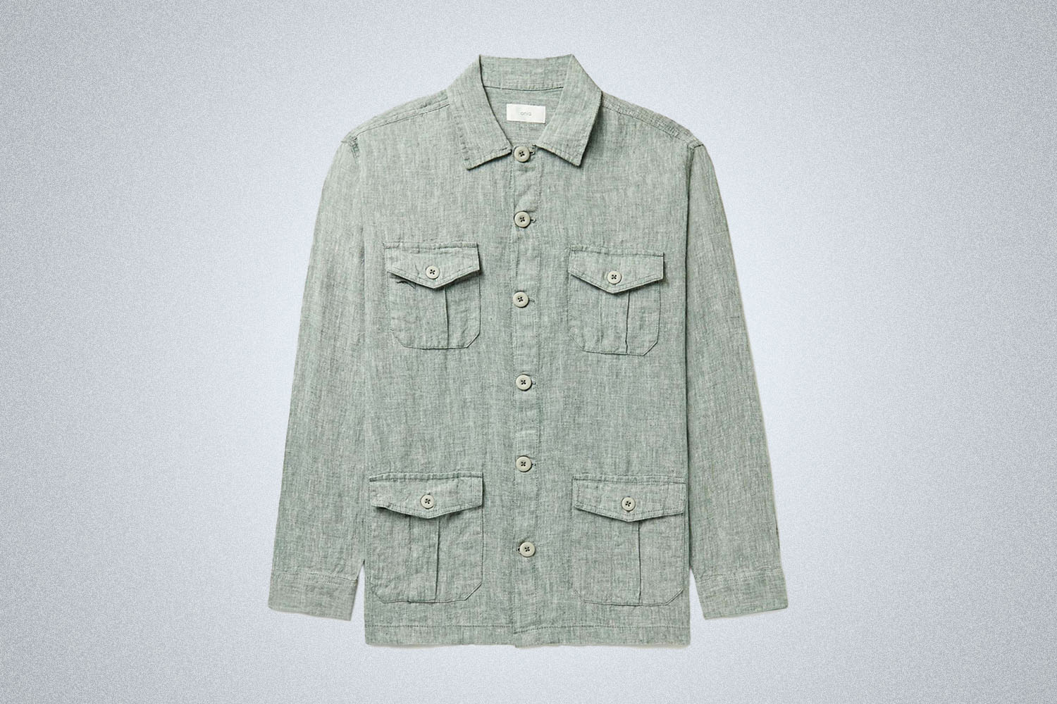 a green-grey linen four pocket overshirt on a grey background